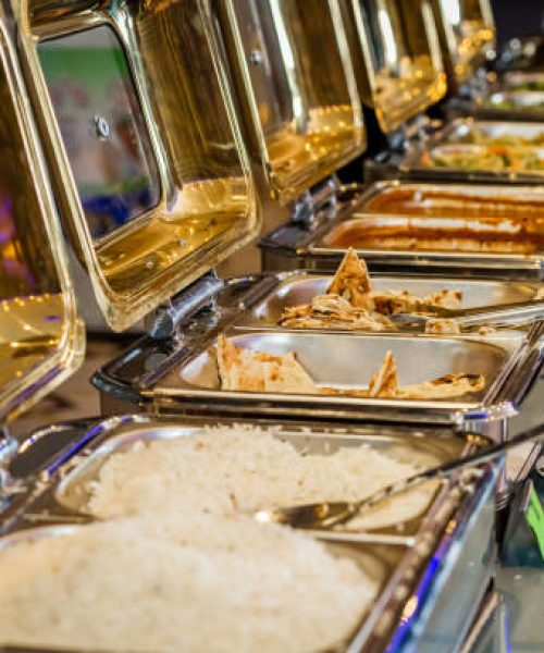 Banquet Catering food on chafing dishes.Banquet Buffet food at Indian Weddings Event.Selective Focus